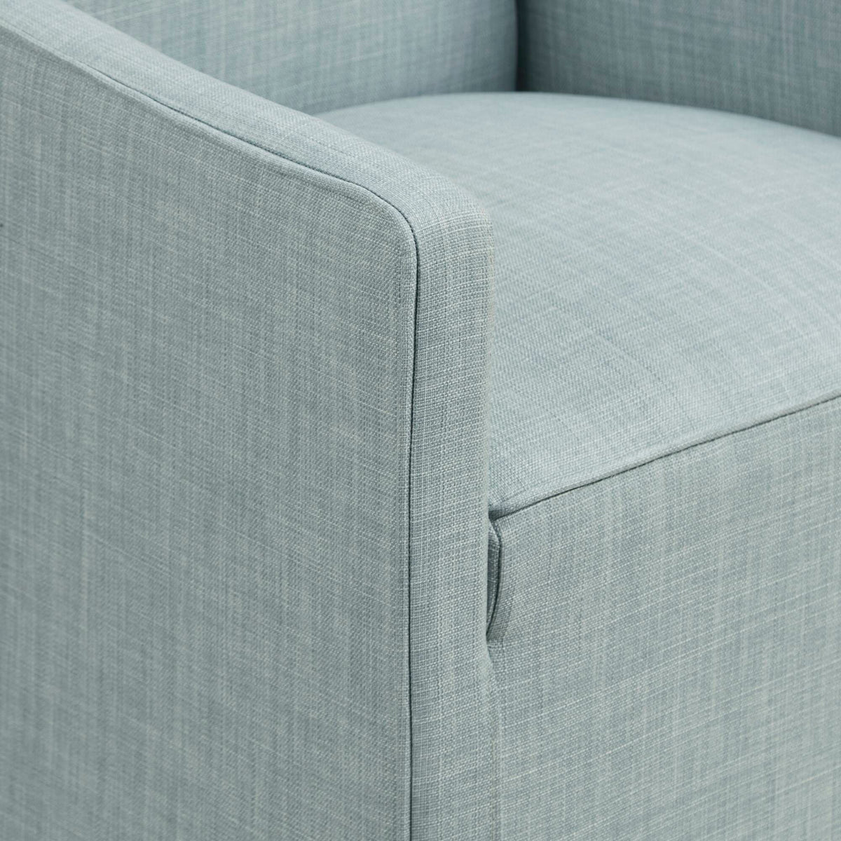 Traditional skirted dining arm chair in gray textured fabric close-up of curved arm on Tampa Home & Garden Store