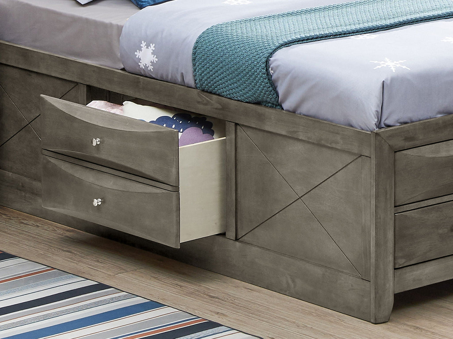 Storage bed with gray wood finish and built-in under-bed drawers; open drawer reveals blankets on Tampa Home & Garden Store