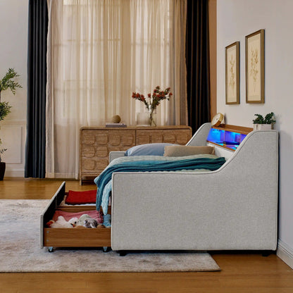 Twin beige upholstered storage beds with open drawers and blue LED lighting in a modern bedroom on Tampa Home & Garden Store