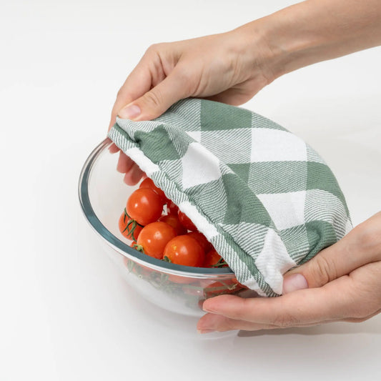 Cloth Bowl Covers over glass bowl in hand, green checkered fabric, Organic Cotton Mart on Tampa Home & Garden Store
