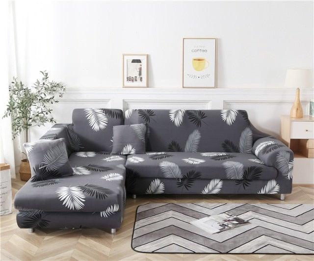 Stevvex elastic sofa cover set for gray L-shaped sectional with white palm print cushions on Tampa Home & Garden Store