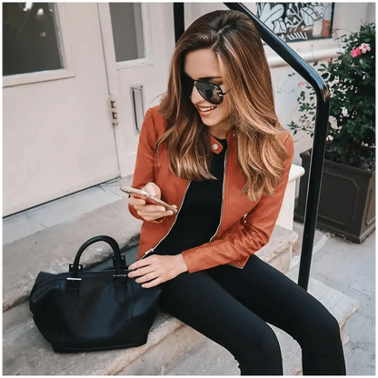 Stevvex women's PU leather jacket burnt orange long-sleeve solid color coat worn on steps on Tampa Home & Garden Store