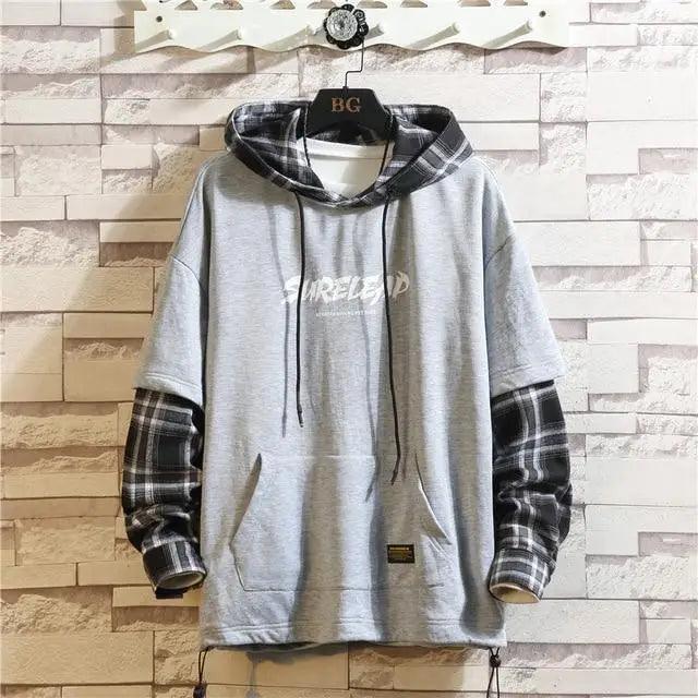 Gray fleece hoodie with black plaid sleeves and hood, pullover with front pocket on Tampa Home & Garden Store