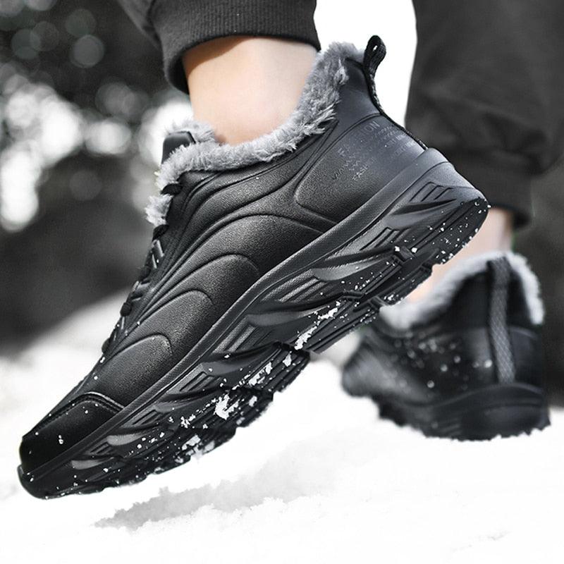Mens black winter boot with grey faux fur lining and rugged outsole in snow on Tampa Home & Garden Store