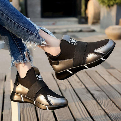 Stevvex pair of black silver slip-on sneakers with breathable upper and elastic strap on Tampa Home & Garden Store