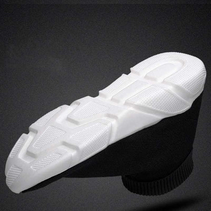 Stevvex sneakers: women's slip-on black stretch upper with chunky white textured outsole on Tampa Home & Garden Store