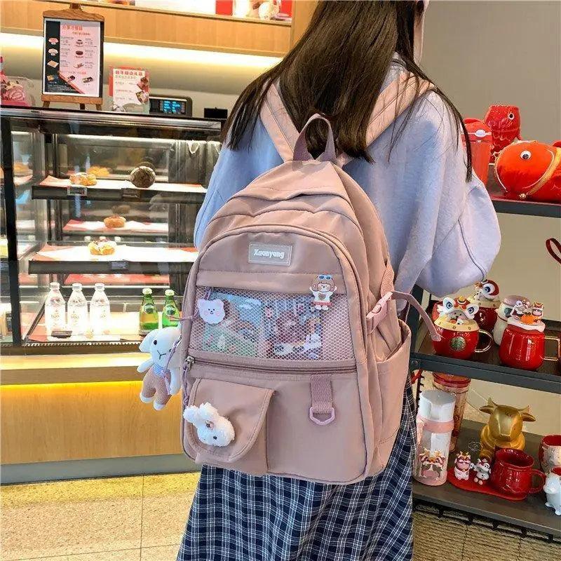 Stevvex pink beige school backpack for teen girls and women with mesh front pocket charms on Tampa Home & Garden Store