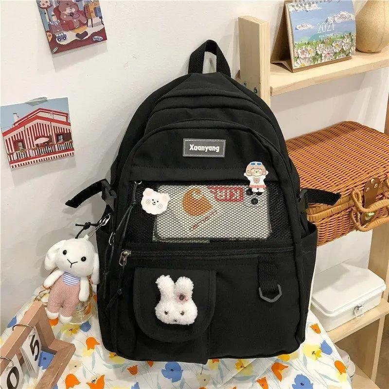 Stevvex black school backpack with front mesh pocket and cute bunny plush keychain on Tampa Home & Garden Store