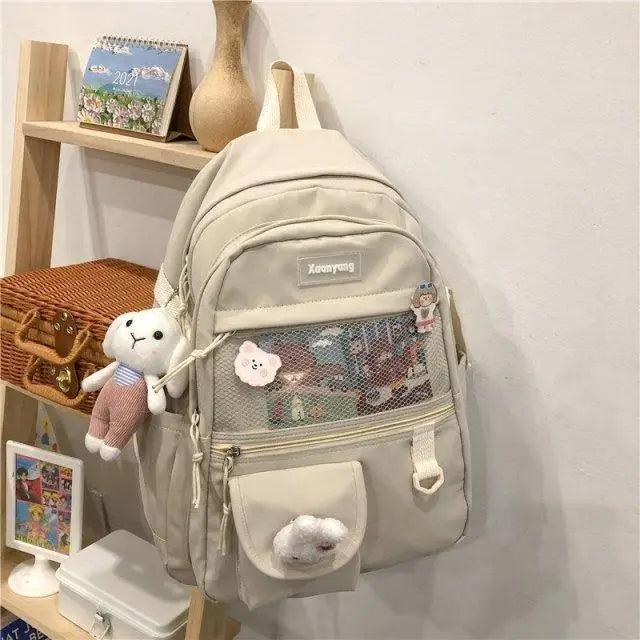 Stevvex beige female backpack with mesh front pocket and plush keychain for teens on Tampa Home & Garden Store