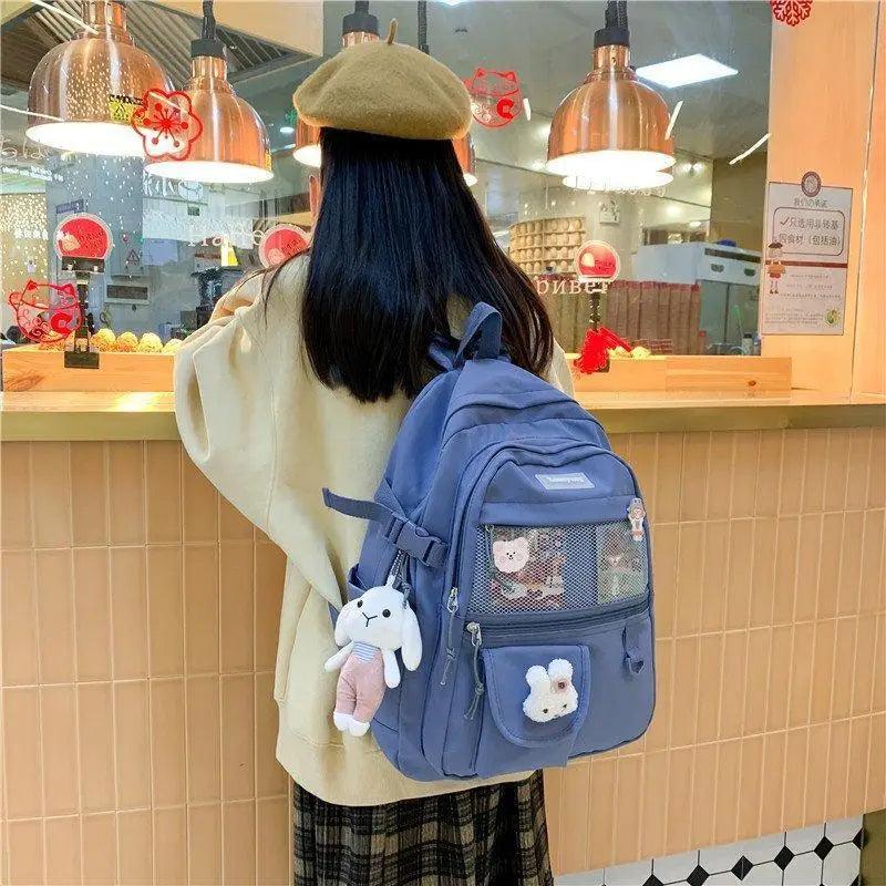 Stevvex blue school backpack with mesh pocket and multiple compartments worn by a teen girl on Tampa Home & Garden Store