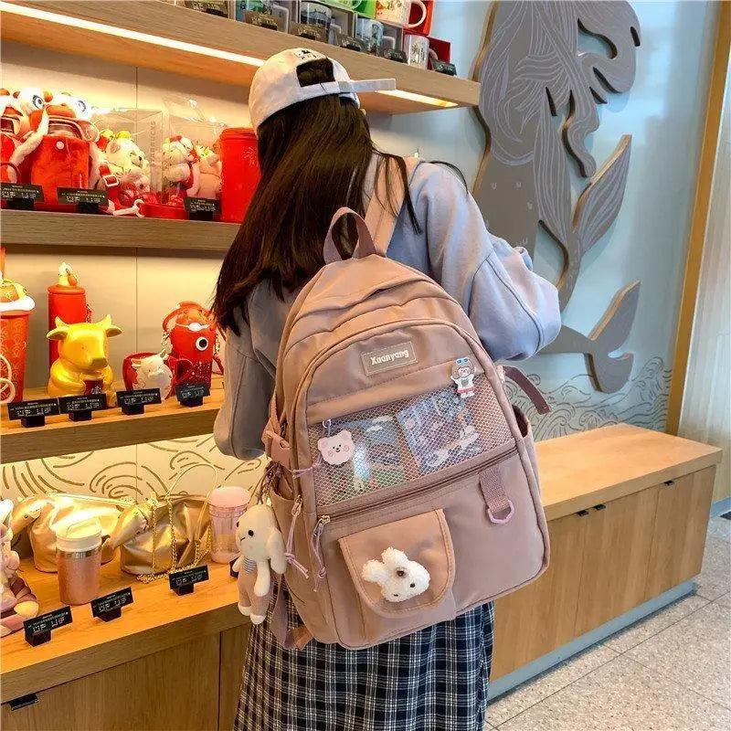 Stevvex elegant female school backpack in pale pink with mesh front pocket and plush keychains on Tampa Home & Garden Store