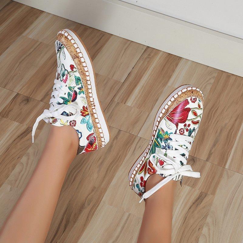 Floral printed white sneakers with lace-up front and round toe espadrille-style sole pair on Tampa Home & Garden Store