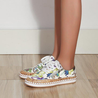 Floral printed lace-up sneakers in white with colorful flowers, round toe and rope-stitched sole on Tampa Home & Garden Store