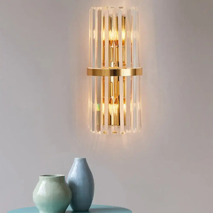Gold crystal prism wall sconce by Decorbites, glass bars, warm glow on Tampa Home & Garden Store