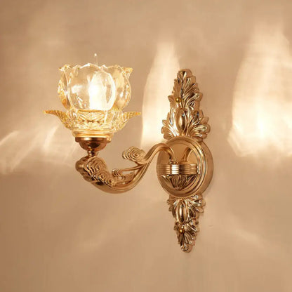 Elegant gold scrolled arm wall sconce with crystal shade by Decorbites for bedroom on Tampa Home & Garden Store
