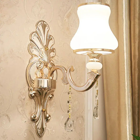 Elegant gold scroll-arm wall sconce with frosted glass shade and crystal drops Decorbites on Tampa Home & Garden Store