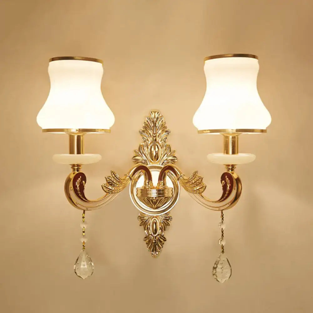 Decorbites elegant gold scroll-arm wall sconce with dual ivory glass shades and crystal drops on Tampa Home & Garden Store