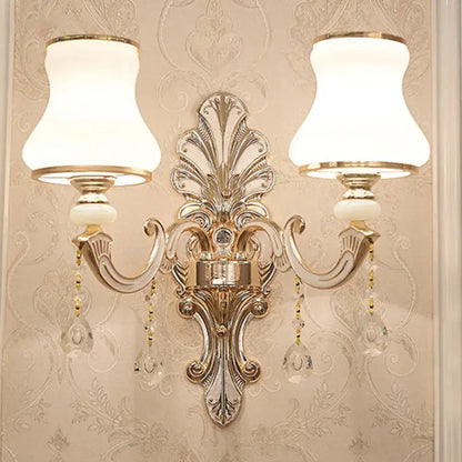 Elegant gold scrolled arm wall sconce by Decorbites with crystal drops and dual white fabric shades on Tampa Home & Garden Store