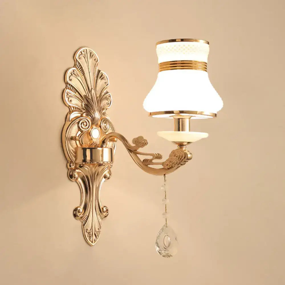 Elegant gold scrolled-arm wall sconce with crystal drop Decorbites bedroom light on Tampa Home & Garden Store