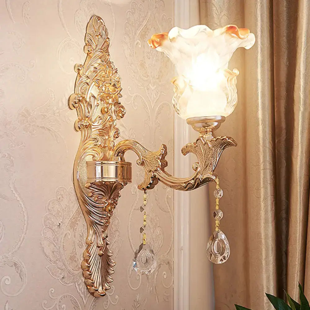 Elegant gold scrolled arm wall sconce with crystal drops and frosted shade Decorbites on Tampa Home & Garden Store