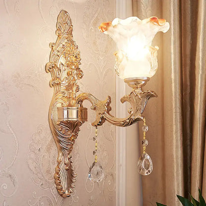 Elegant gold scrolled arm wall sconce with crystal drops and frosted shade Decorbites on Tampa Home & Garden Store