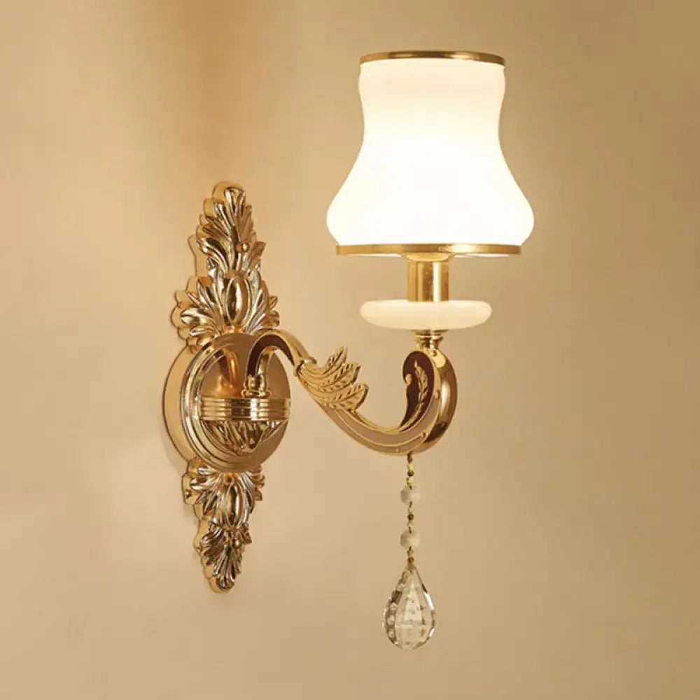 Decorbites ornate gold scroll-arm wall sconce with crystal drop and white glass shade on Tampa Home & Garden Store