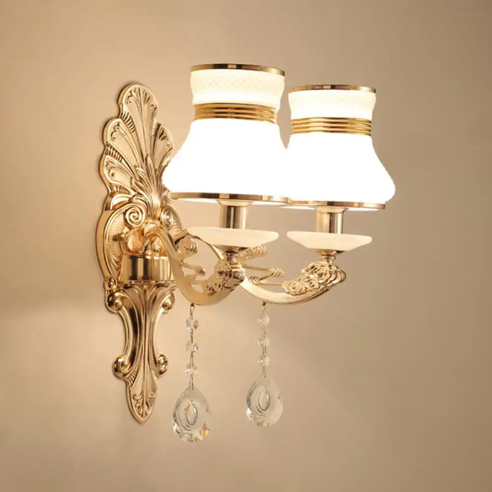 Elegant gold wall sconce by Decorbites with scrolled arms, crystal drops and glass shades on Tampa Home & Garden Store