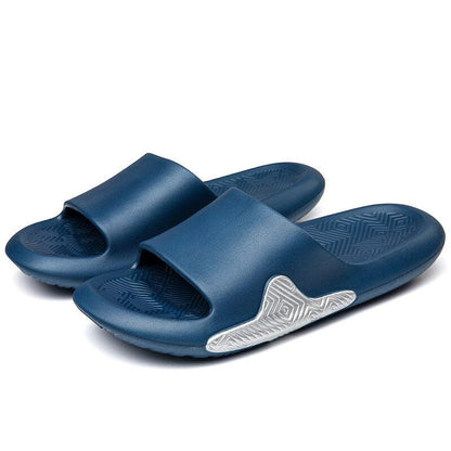 Pair of blue slide slippers with wide strap, textured footbed, non-slip EVA sole on Tampa Home & Garden Store