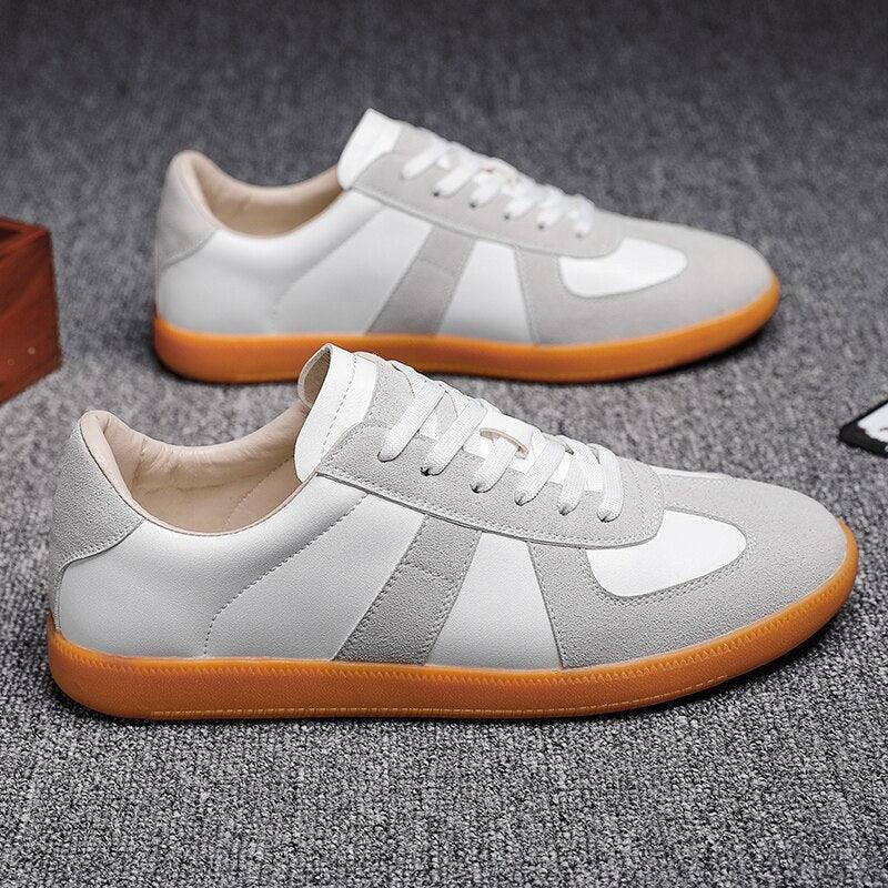 Stevvex men's sneakers pair in white and gray with orange sole, lace-up casual sneakers on Tampa Home & Garden Store