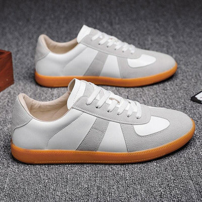 Stevvex men's sneakers pair in white and gray with orange sole, lace-up casual sneakers on Tampa Home & Garden Store