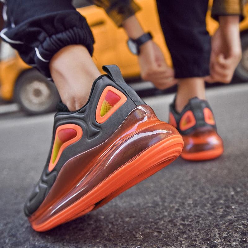 Stevvex athletic shoes pair with orange air cushion sole, black mesh breathable non-slip on Tampa Home & Garden Store