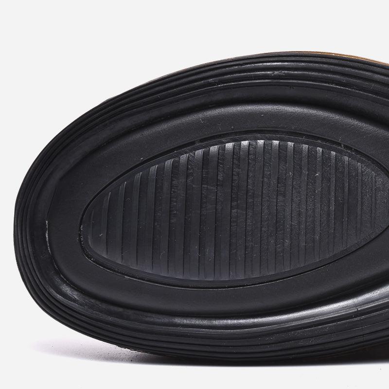 Elegant Stevvex athletic sneakers sole close-up in black rubber with oval ridged tread non-slip on Tampa Home & Garden Store