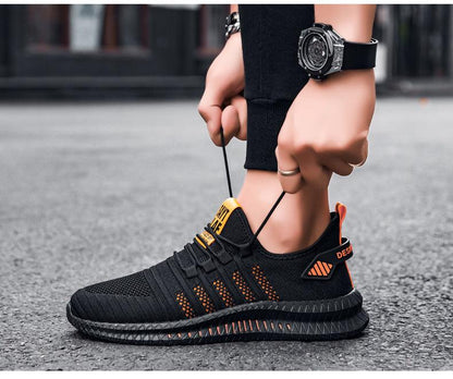 Stevvex men's sneakers black knit upper with orange accents, breathable lightweight footwear on Tampa Home & Garden Store