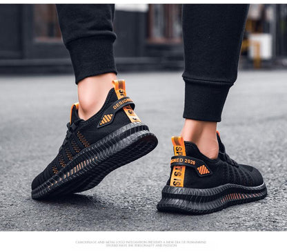 Stevvex men's black running sneakers with orange heel tabs, breathable knit upper and outsole on Tampa Home & Garden Store