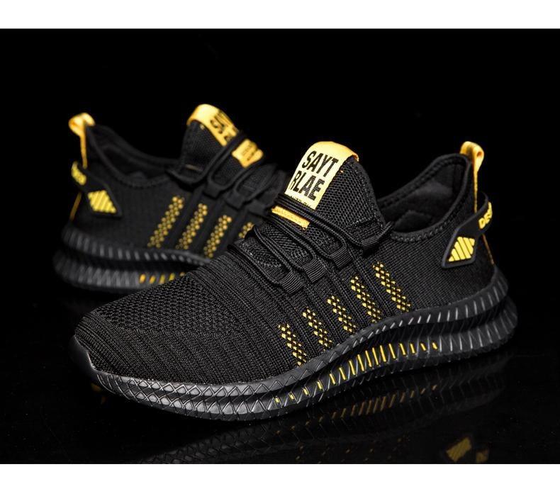 Stevvex black breathable sneakers pair with yellow accents and knit upper running trainers on Tampa Home & Garden Store
