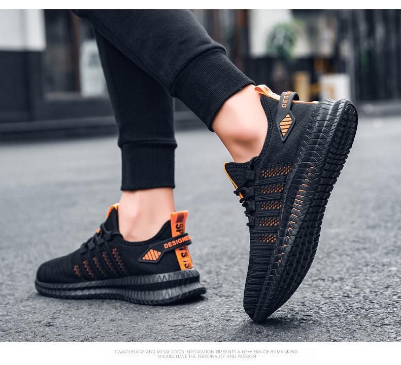 Stevvex men's black knit sneakers with orange accents, breathable mesh, non-slip outsole on Tampa Home & Garden Store