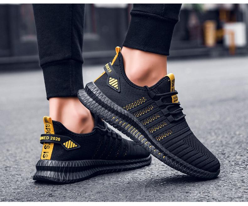 Stevvex men's sneakers black breathable knit upper with yellow accents, non-slip outsole on Tampa Home & Garden Store