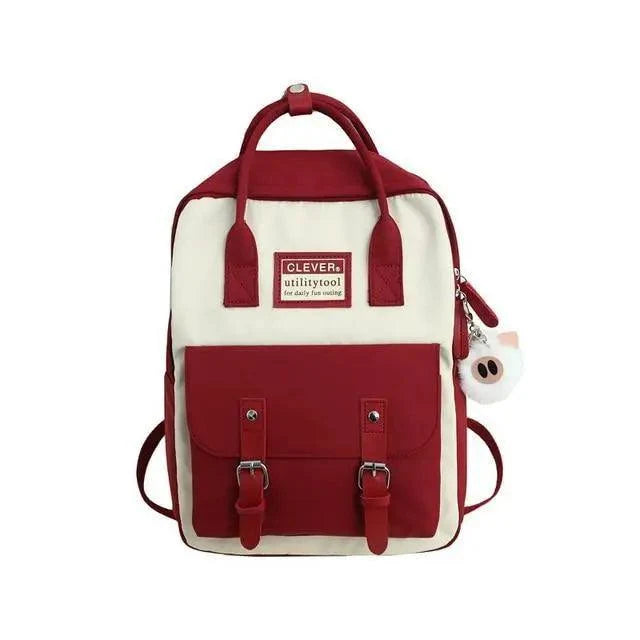 Elegant nylon candy-color waterproof school backpack with red front pocket and dual buckle straps on Tampa Home & Garden Store