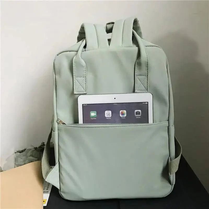 Stevvex nylon candy color waterproof school backpack with front tablet pocket in mint green on Tampa Home & Garden Store