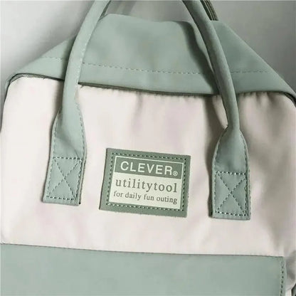 Mint nylon school backpack with pastel color blocks and a CLEVER utilitytool patch on Tampa Home & Garden Store