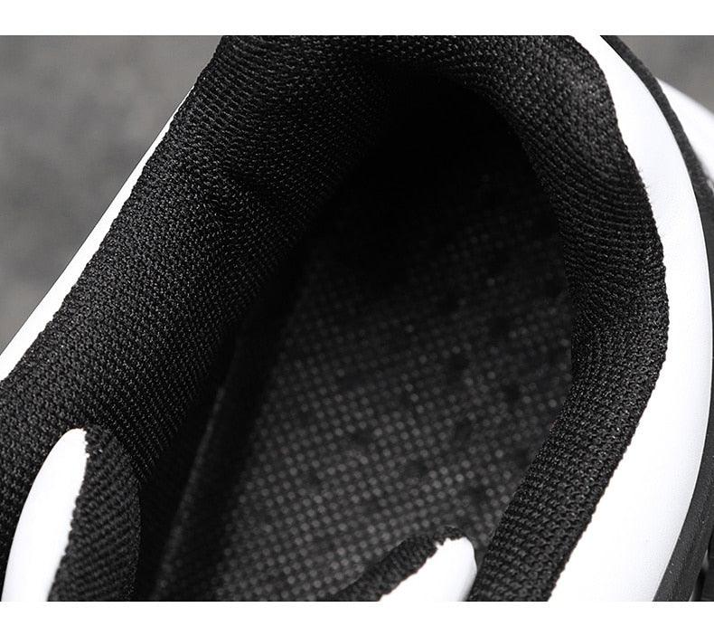 Elegant sport sneaker interior close-up, black knitted lining with white midsole on Tampa Home & Garden Store