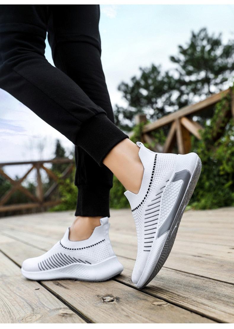 Stevvex white knit sneakers with slip-on sock style, black, white midsole, gray outsole on Tampa Home & Garden Store