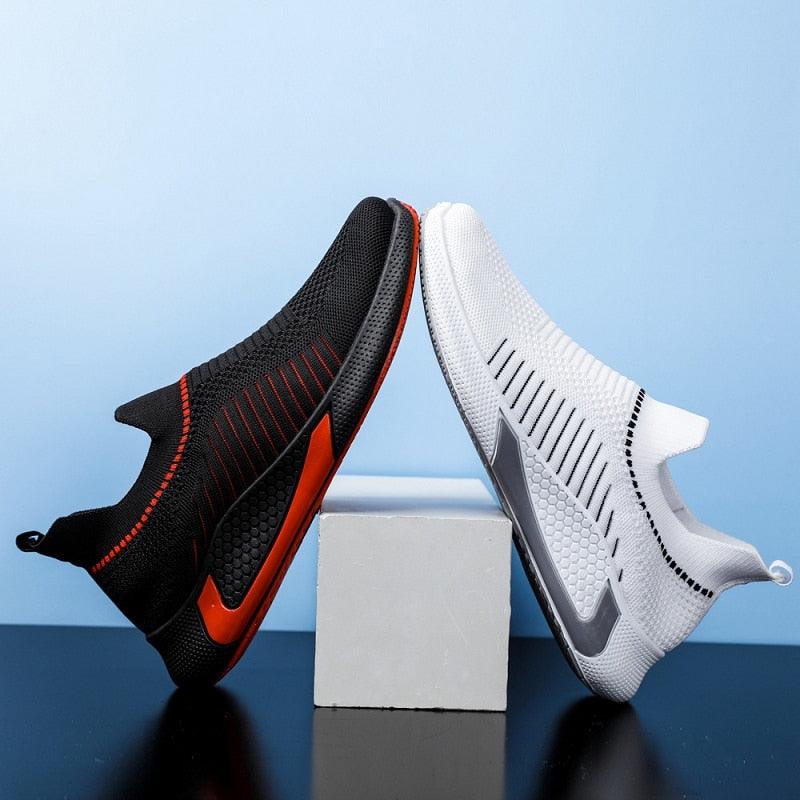 Stevvex Elegant Sport Mens Sneakers pair in black with orange trim and white knit upper on Tampa Home & Garden Store
