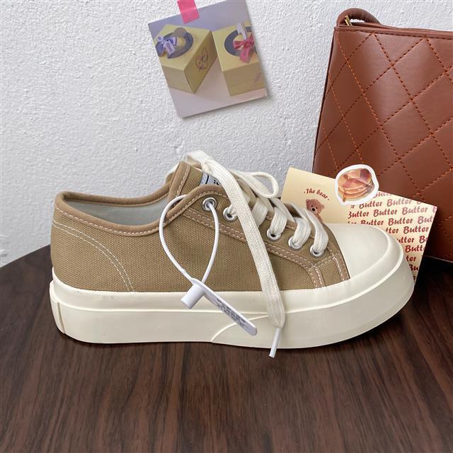 Stevvex beige canvas low-top sneakers with white platform sole and lace-up front on Tampa Home & Garden Store
