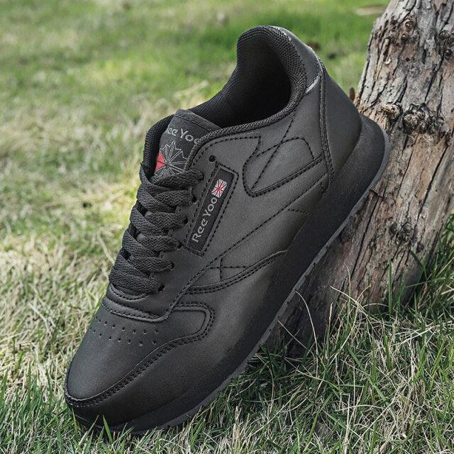 Stevvex black leather sneakers lace-up, low-profile athletic shoes on grass on Tampa Home & Garden Store