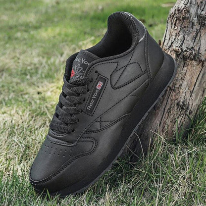 Stevvex black leather sneakers lace-up, low-profile athletic shoes on grass on Tampa Home & Garden Store