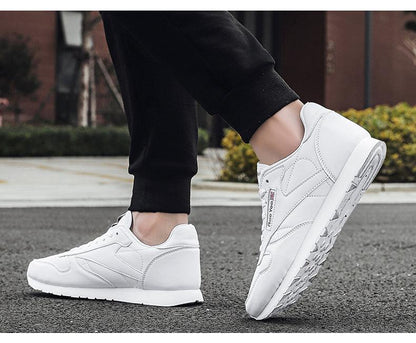 Stevvex women's white leather sneakers with lace-up closure and slim low-profile sole on Tampa Home & Garden Store