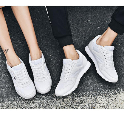 Stevvex white leather sneakers, lace-up, breathable mesh panels, 3 pairs shown on pavement on Tampa Home & Garden Store