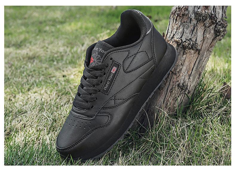 Stevvex black leather sneakers lace-up training shoes on grass beside a tree on Tampa Home & Garden Store