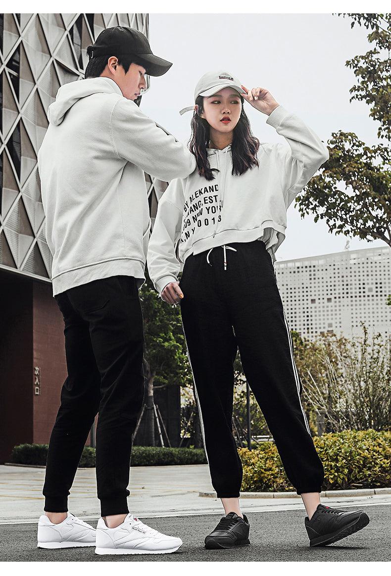 Stevvex sneakers two pairs white left and black right lace-up casual trainers worn by models on Tampa Home & Garden Store